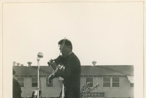 Violinist at a hospital tea party (ddr-densho-37-1257)