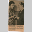 Clipping with photo of Mary Mon Toy presenting ticket to The World of Suzie Wong to Oppenehim Collins executive (ddr-densho-367-226)