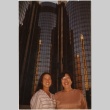 Two women in front of a skyscraper (ddr-manz-7-32)