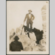 Man standing on rocks (ddr-densho-316-212)
