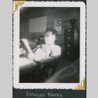 Man sitting in chair reading (ddr-densho-434-187)
