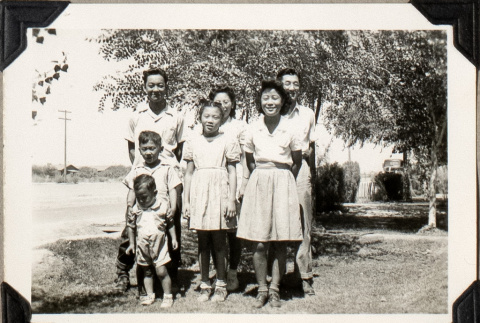 Portrait of family standing on lawn (ddr-densho-587-28)