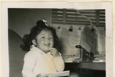 Suzanne holding a letter (ddr-densho-37-1200)