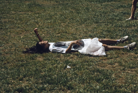 Sharon Yamasaki laying in the grass (ddr-densho-336-1608)
