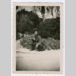 Soldier kneeling in front of garden (ddr-densho-368-158)