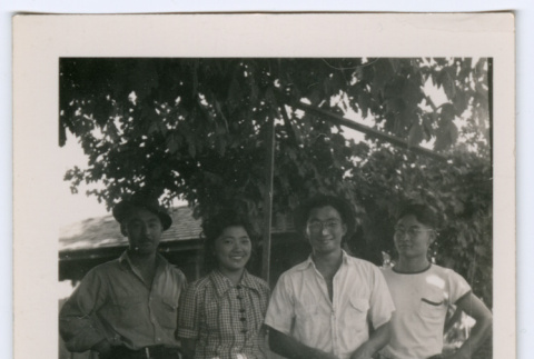 Four people in a garden (ddr-densho-329-804)