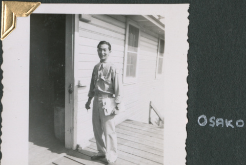 Man with clipboard on loading dock (ddr-densho-434-236)