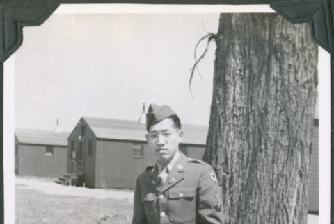 Man in uniform holding cigarette (ddr-ajah-2-435)