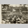 A large crowd walking through the entrance of a shrine (ddr-njpa-8-46)
