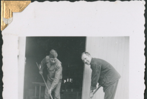 Two men sweeping (ddr-densho-434-203)