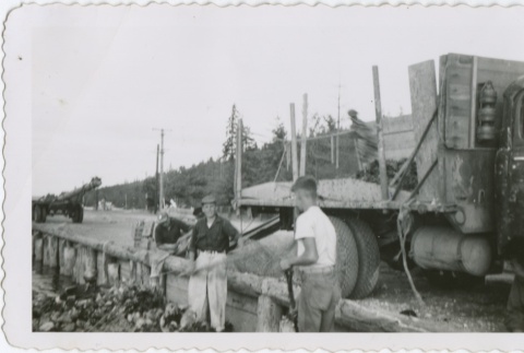 Three men working on an oyster farm (ddr-densho-296-207)
