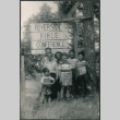 Group standing in front of a Riverside Bible Conference sign (ddr-densho-523-214)