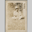 Man sitting on grass (ddr-densho-316-251)