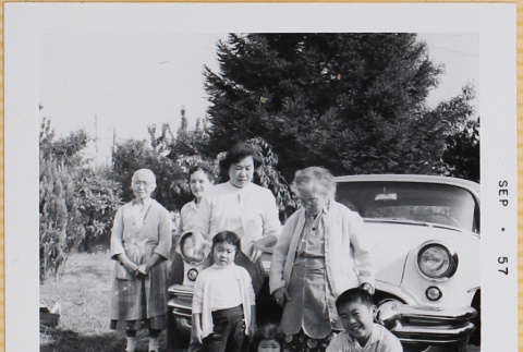 Yoshiko, Leslie, Susan and William Shiomi with three unidentified women by car (ddr-densho-522-425)