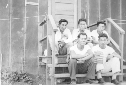 Nisei men in front of barracks (ddr-densho-157-69)