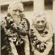 A man and woman wearing leis (ddr-njpa-1-403)