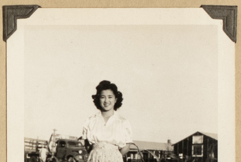 Mits Kikawa beside a garden (ddr-densho-542-517)