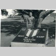 Soldier in front of a U.S. military sign (ddr-densho-22-359)