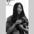 Lynn Hikiko holding a camera (ddr-densho-336-638)