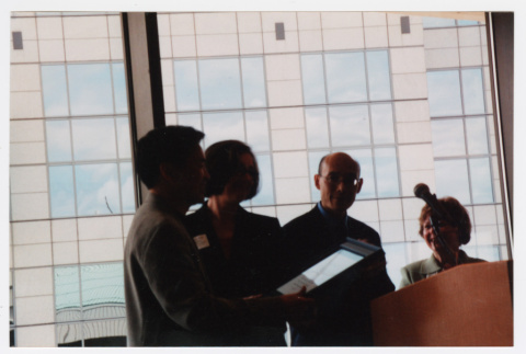 Tom Ikeda receiving his Humanities Washington Award (ddr-densho-506-31)