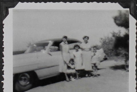 A family in front of a car (ddr-densho-300-475)