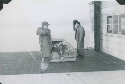 Shoichi Suyama and Jim Kawano at a boathouse (ddr-densho-201-714)
