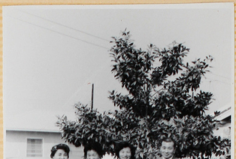 Three women and a man outside house (ddr-densho-522-59)