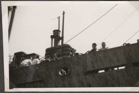Men standing by rail of ship (ddr-densho-466-107)
