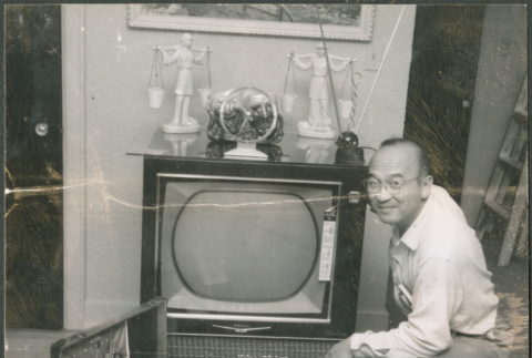 Chester Sakura Sr. with new TV (ddr-densho-523-451)