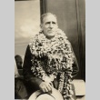 A man wearing leis (ddr-njpa-1-1954)