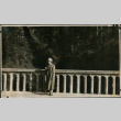 Women poses on bridge (ddr-densho-359-554)