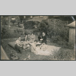 Family at a backyard picnic (ddr-densho-523-96)