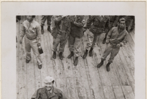 Man standing on dock, viewed from ship (ddr-densho-466-320)