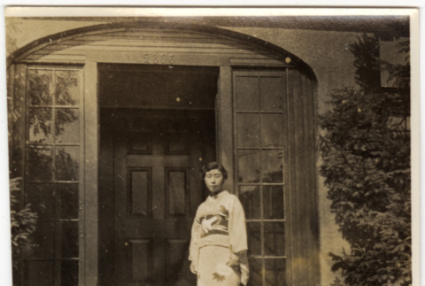 Woman in kimono standing by door (ddr-densho-426-1824)