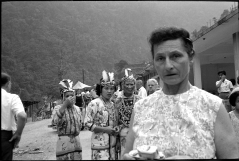 Woman with camera, with three women in costume behind her (ddr-densho-426-2415)