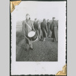 Man with drum with group in background (ddr-densho-434-53)