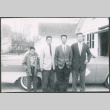 Sakura brothers standing next to car (ddr-densho-523-291)