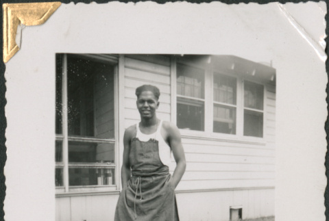 African American man wearing apron outside building (ddr-densho-434-169)