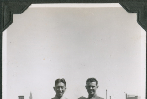 Two men standing on rooftop.  Joe Iwataki on left (ddr-ajah-2-603)