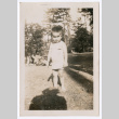 Toddler standing in grass at picnic (ddr-densho-483-655)