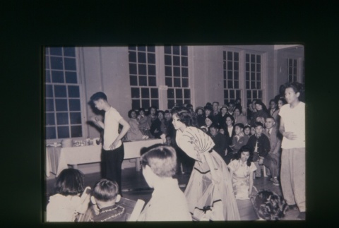 (Slide) - Image of group of young people in large room (ddr-densho-330-124-master-8dc8f9528b)