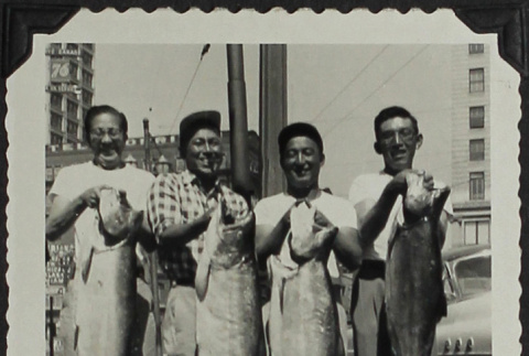 Four men holding fish (ddr-densho-300-421)