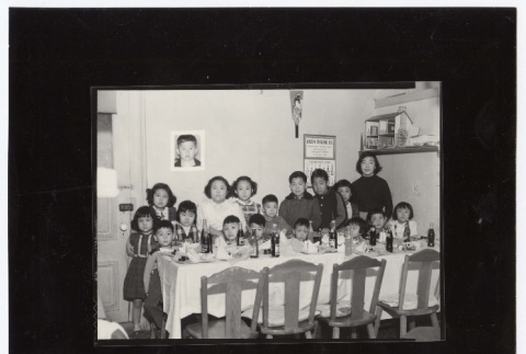 Photograph of a group of kids posed around a table (ddr-densho-259-707)