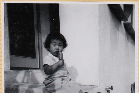 Susan Shiomi eating a popsicle (ddr-densho-522-273)