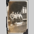 Four men sitting on porch (ddr-densho-326-348)