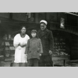 [Family at Japanese marketplace] (ddr-csujad-29-94)