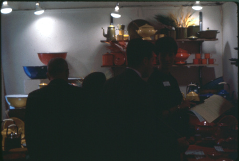 Group looking at enamel and lacquerware display (ddr-densho-426-333)