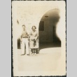 A man and woman standing in front of a building (ddr-densho-298-287)