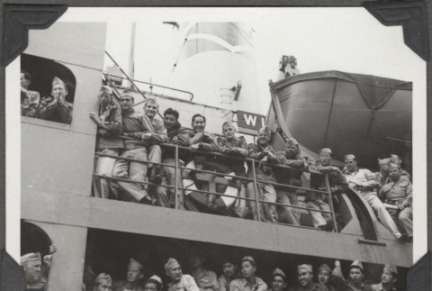 Men standing along rail of ship (ddr-densho-466-147)