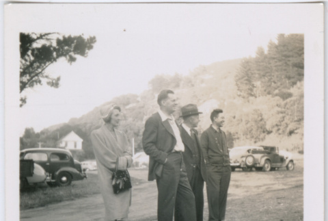 Four people on a lawn (ddr-densho-329-823)